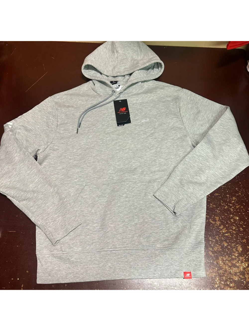 New Balance gray, silver reflective men’s pullover hoodie, medium